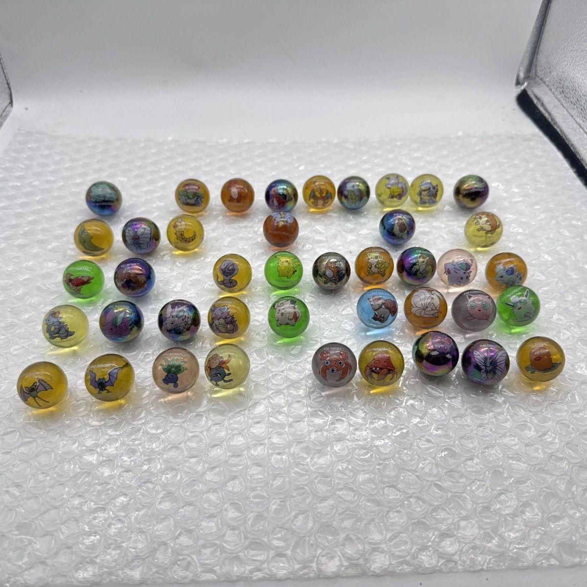 بضائع بوكيمون الرسمية غير المع - مراجعة Vintage Collectible Marbles وسعره